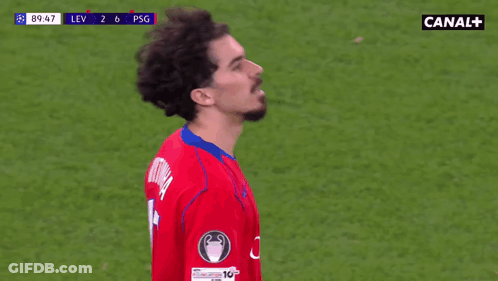 Man In Red Shirt Thumbs Up At Soccer Game Sponsored By Canal+ GIF