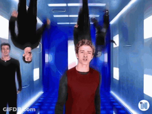 Man In Red Shirt Upside Down In Hallway With N GIF