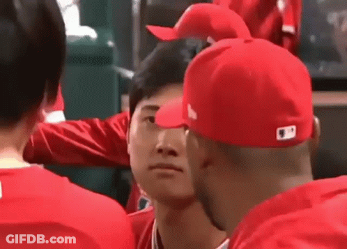 Man In Red Shirt Using Cell Phone GIF
