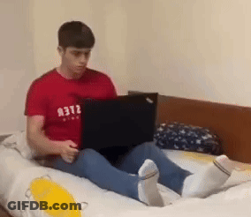 Man In Red Shirt Using Laptop GIF