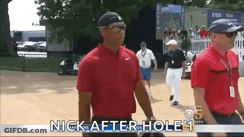 Man In Red Shirt Walking Golf Course GIF