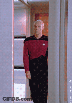 Man In Red Shirt Walking Through Doorway GIF