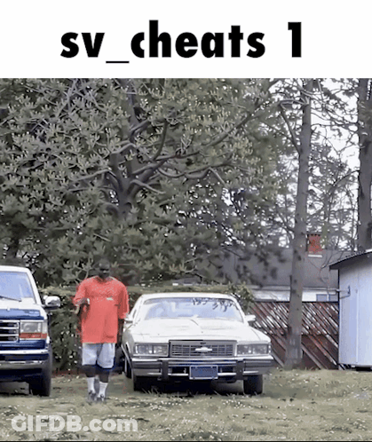 Man In Red Shirt Walking Towards White Car In Yard GIF