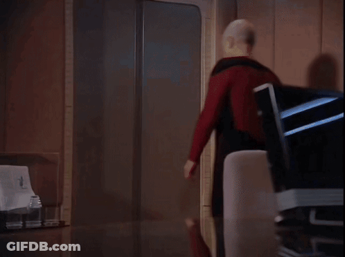 Man In Red Shirt Walks Into Room GIF