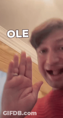 Man In Red Shirt Waving Ole GIF