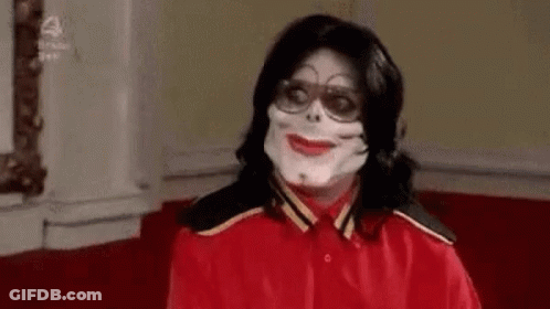 Man In Red Shirt Wearing Mask And Glasses GIF