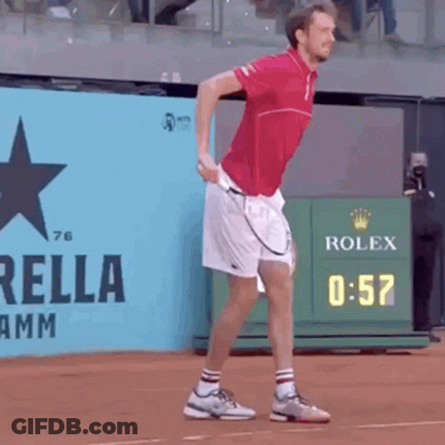 Man In Red Shirt White Shorts With Tennis Racquet GIF