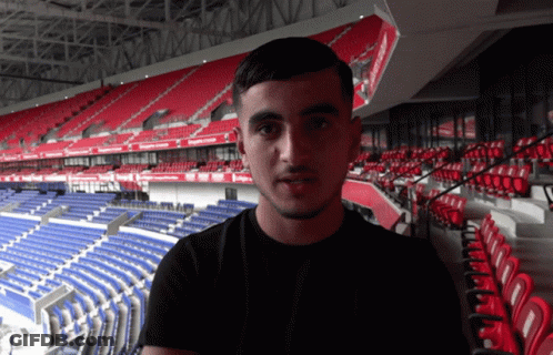 Man In Red Shirt With Arabic Writing GIF