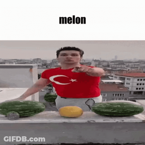 Man In Red Shirt With C Pointing To Melon GIF