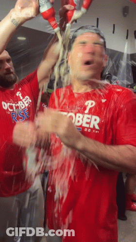 Man In Red Shirt With Letter P Showered With Beer GIF