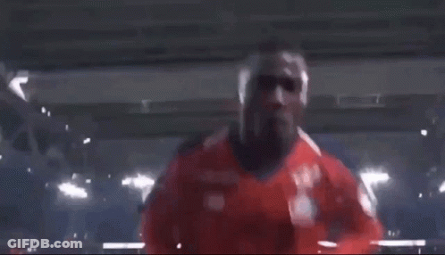 Man In Red Shirt With New Balance Logo GIF