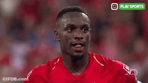 Man In Red Shirt With Play Sports Logo GIF