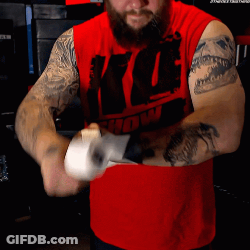 Man In Red Shirt With Show Wrapping Hands GIF