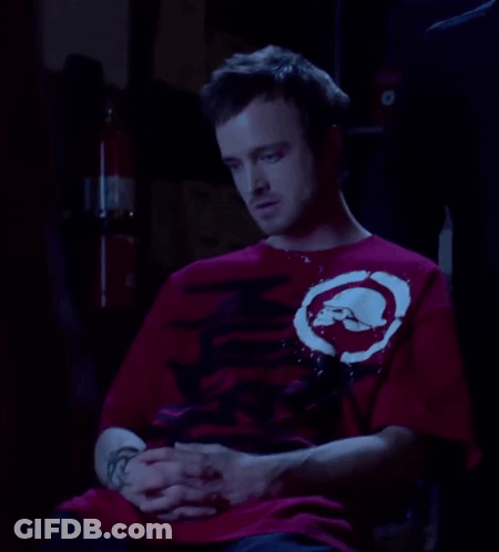 Man In Red Shirt With White Circle GIF