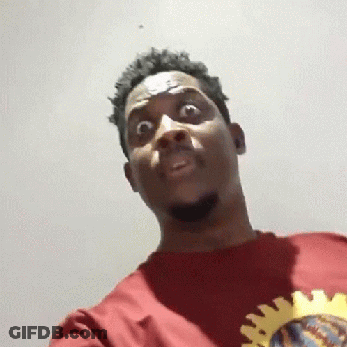 Man In Red Shirt With Yellow Sun Making Funny Face GIF