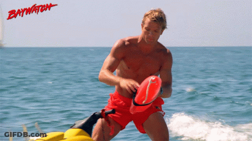 Man In Red Shorts Riding Jet Ski Ocean Baywatch GIF