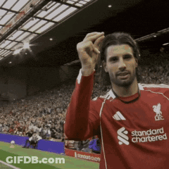 Man In Red Standard Chartered Jersey GIF