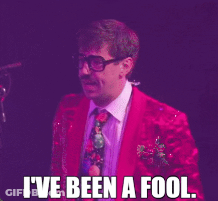 Man In Red Suit And Tie At Microphone GIF