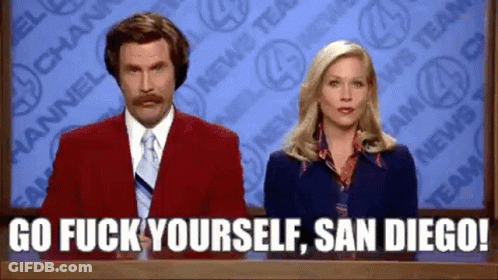 Man In Red Suit And Tie Beside Blue Dress Woman GIF