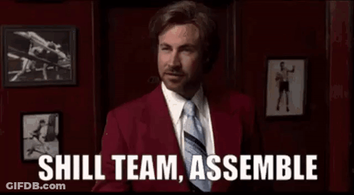 Man In Red Suit And Tie Saying Shill Team Assemble GIF