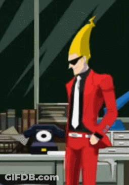 Man In Red Suit And Tie Standing At Desk GIF