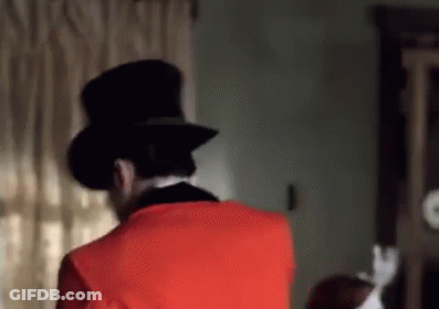 Man In Red Suit And Top Hat GIF