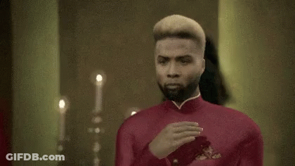Man In Red Suit At Mirror GIF