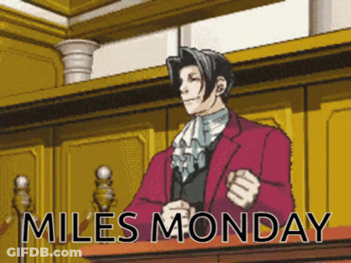 Man In Red Suit At Podium Miles Monday GIF