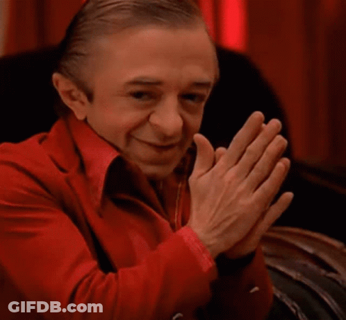Man In Red Suit Clapping GIF