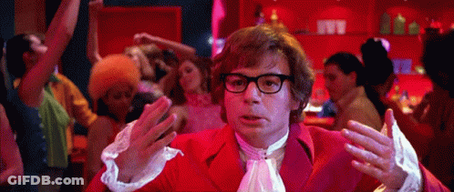 Man In Red Suit Dancing In Front Of Crowd GIF