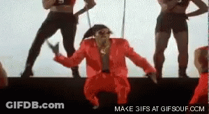 Man In Red Suit Dancing On Stage GIF