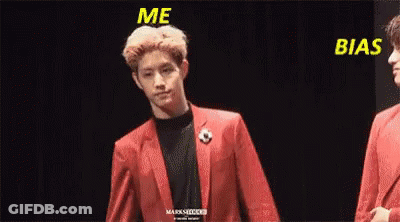 Man In Red Suit Holding Another Man's Hand GIF