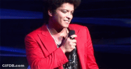 Man In Red Suit Holding Microphone GIF