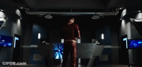 Man In Red Suit In Dark Room GIF