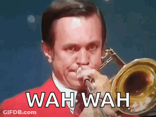 Man In Red Suit Playing Trombone Wah Wah GIF