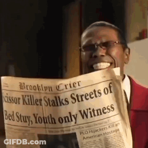 Man In Red Suit Reading Newspaper GIF
