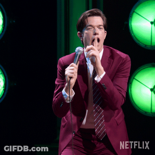 Man In Red Suit Singing Into Microphone Netflix GIF