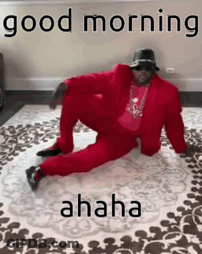 Man In Red Suit Sitting Cross-Legged GIF
