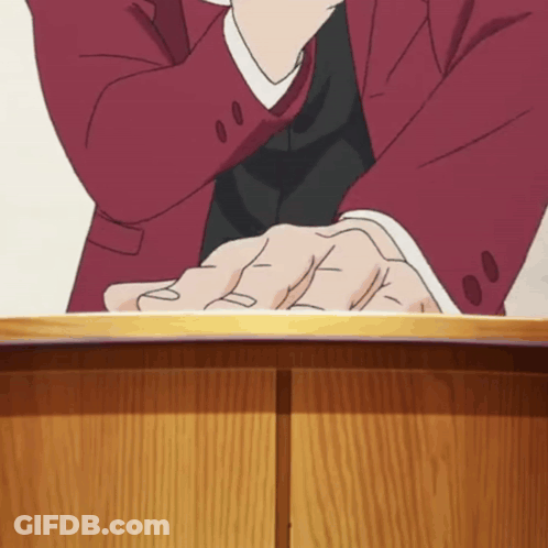 Man In Red Suit Sitting With Hands Folded GIF