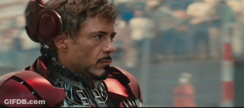 Man In Red Suit With Headphones GIF