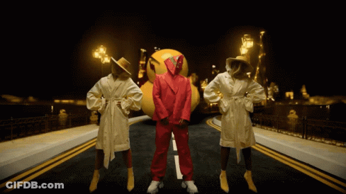 Man In Red Suit With Two Women In Bathrobes GIF