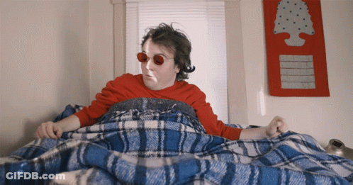 Man In Red Sunglasses Under Blue And White Blanket GIF