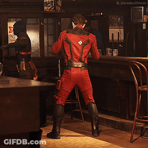 Man In Red Superhero Costume Dancing GIF