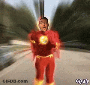 Man In Red Superhero Costume Running Down Road GIF