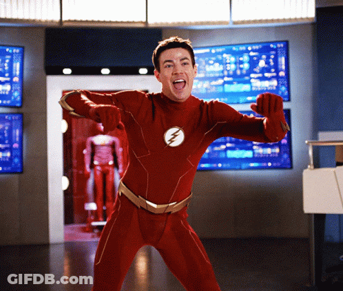 Man In Red Superhero Costume With Lightning Bolt GIF