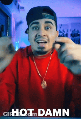 Man In Red Sweater And Hat Making Funny Face Saying Hot Damn GIF