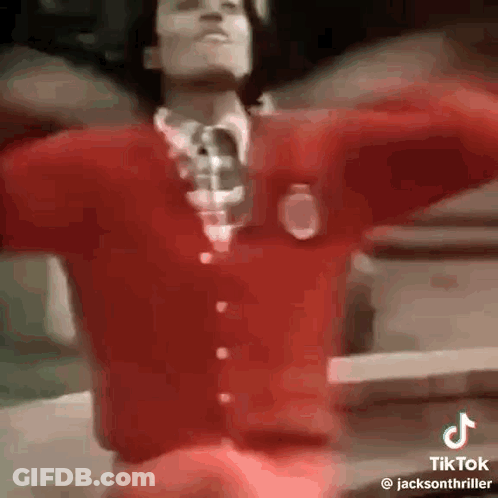 Man In Red Sweater And Tie Dancing GIF