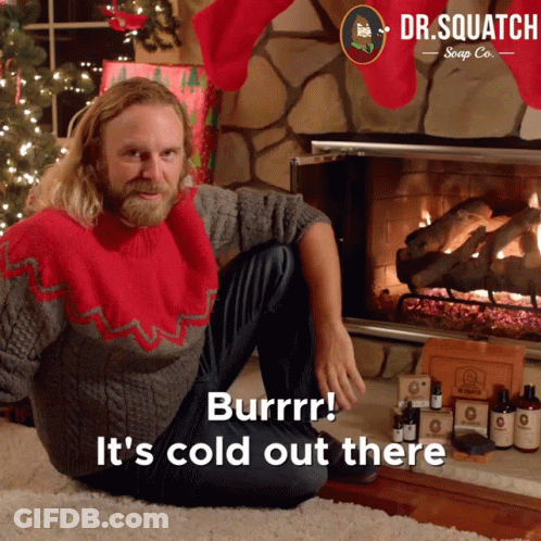 Man In Red Sweater By Fireplace GIF