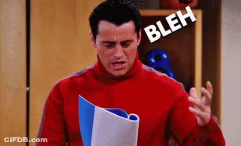 Man In Red Sweater Holding Book Making Face GIF