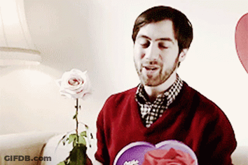 Man In Red Sweater Holding Rose And Heart GIF